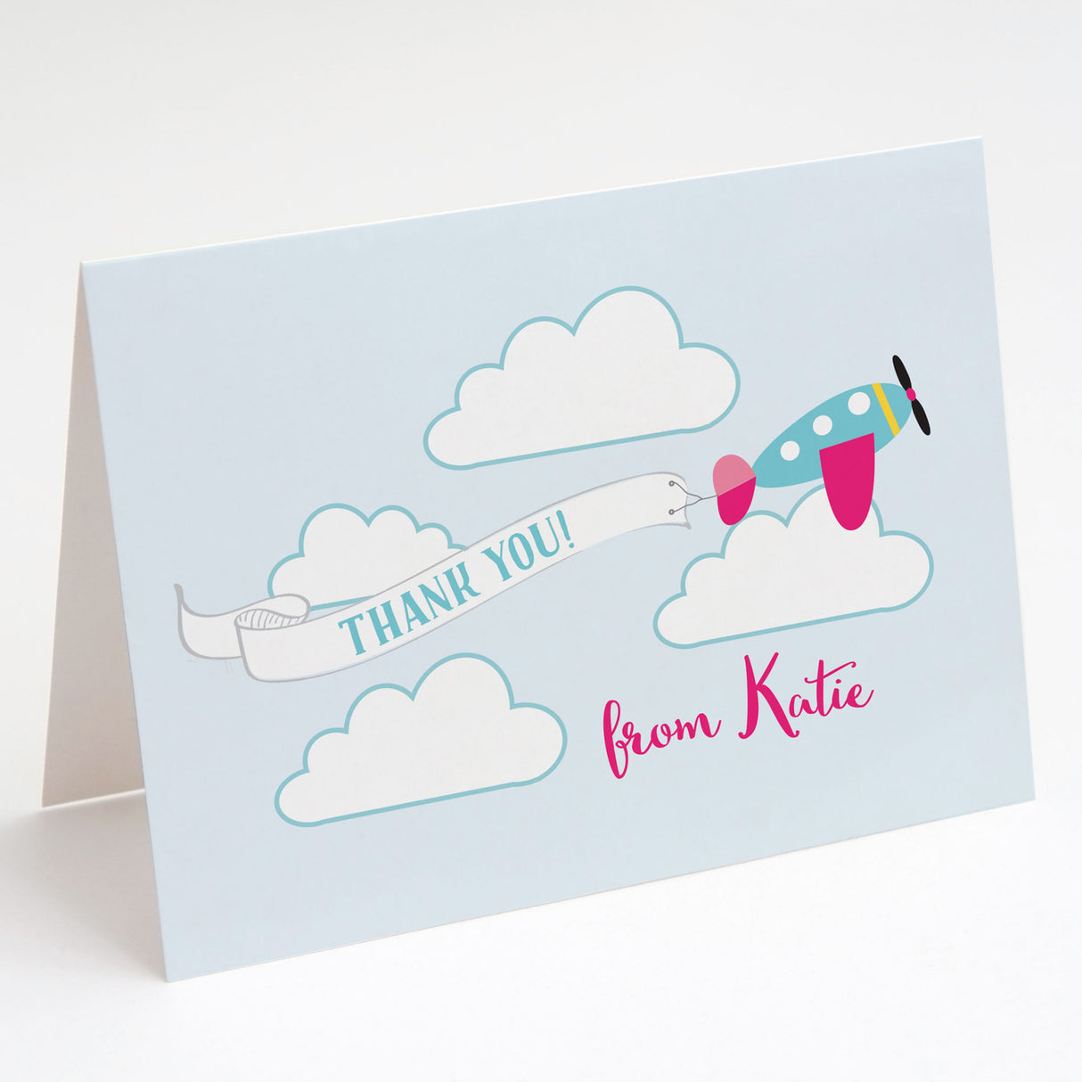 thank you cards with pink and blue airplane design printed on white cardstock