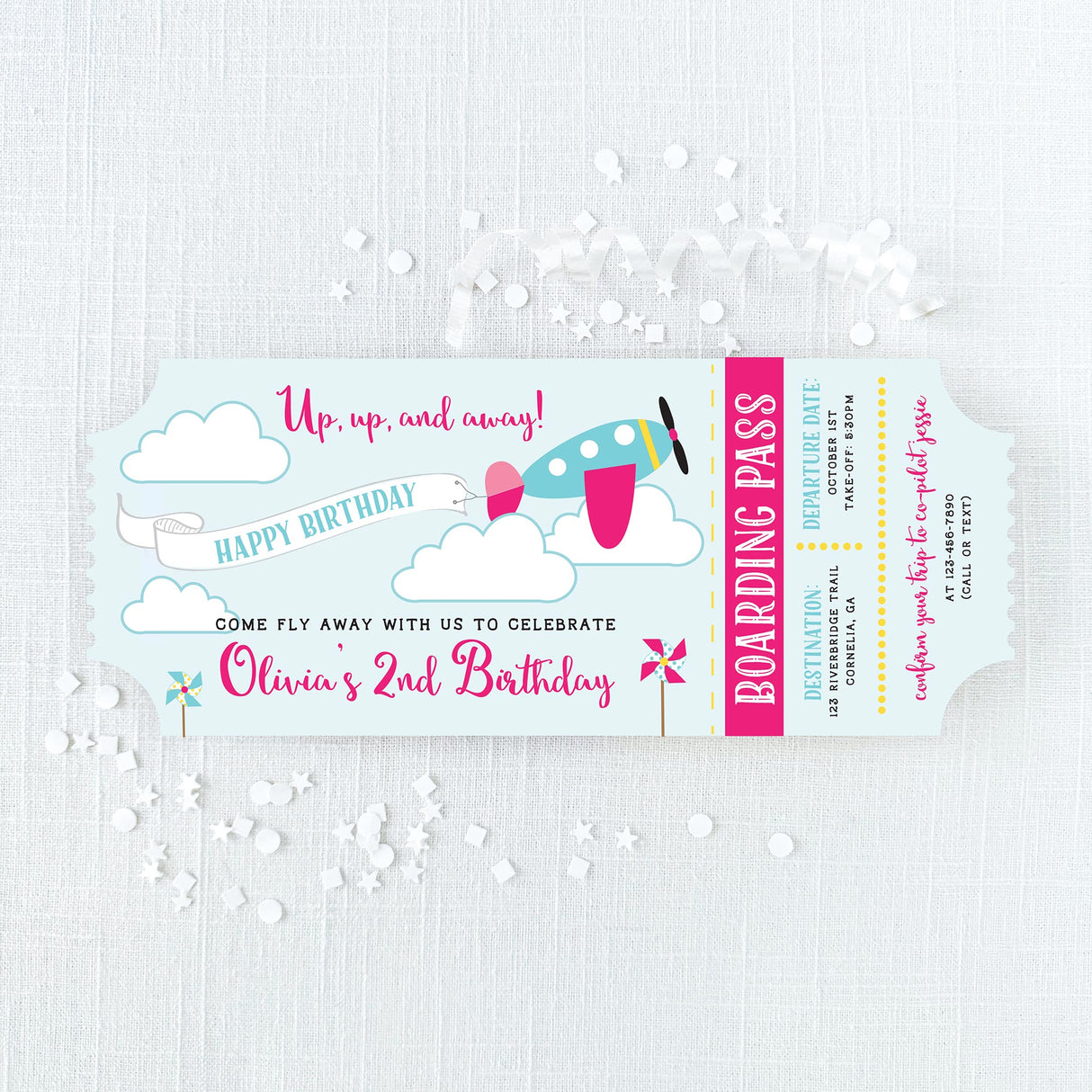 Airplane-themed birthday invitations that look like plane tickets with pink and turquoise colors printed on cardstock