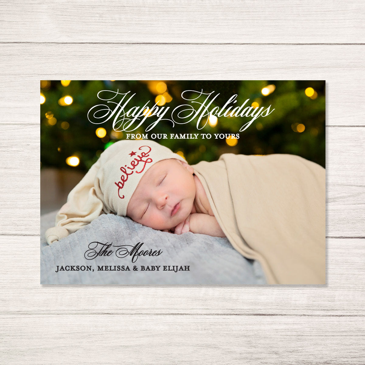 baby's first holiday photo card with personalized photo featuring traditional script font printed on ultra white cardstock