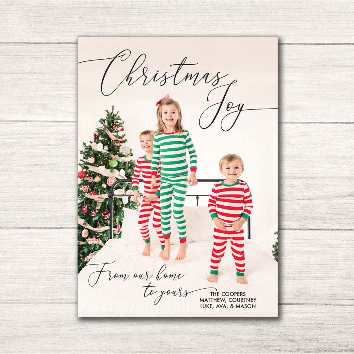 modern Christmas holiday card featuring personalized photo and christmas joy text in a script font printed on ultra white cardstock