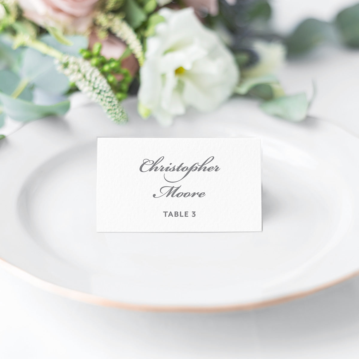 classic folded escort card with traditional gray script and block fonts