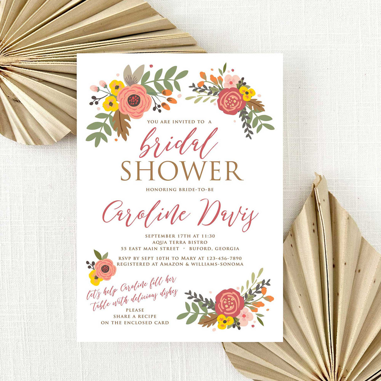 Bridal shower invitation with fall floral design on a white background