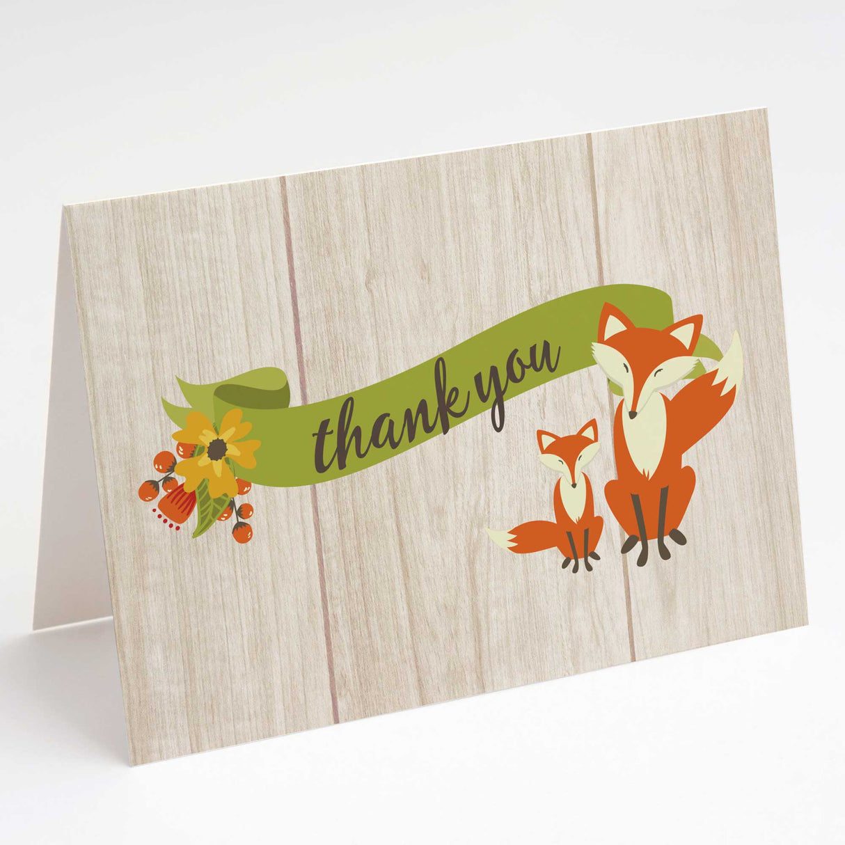 Greeting card with fox illustration and 'thank you' text on a wooden texture background