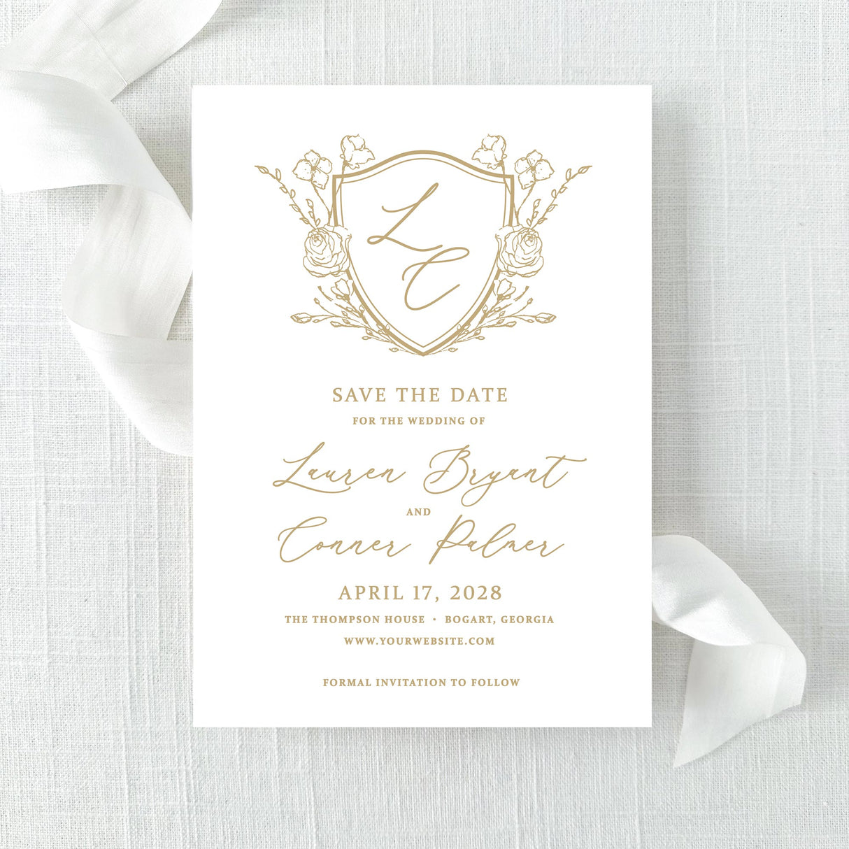 Wedding save the date with gold monogram floral crest with hand calligraphy script font printed on white cardstock