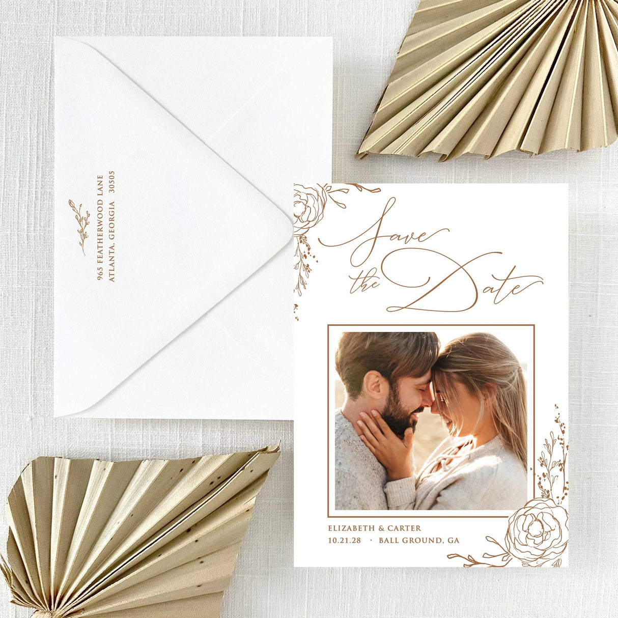 Save the Date card with photo of couple and brown floral edges and envelope with return addressing