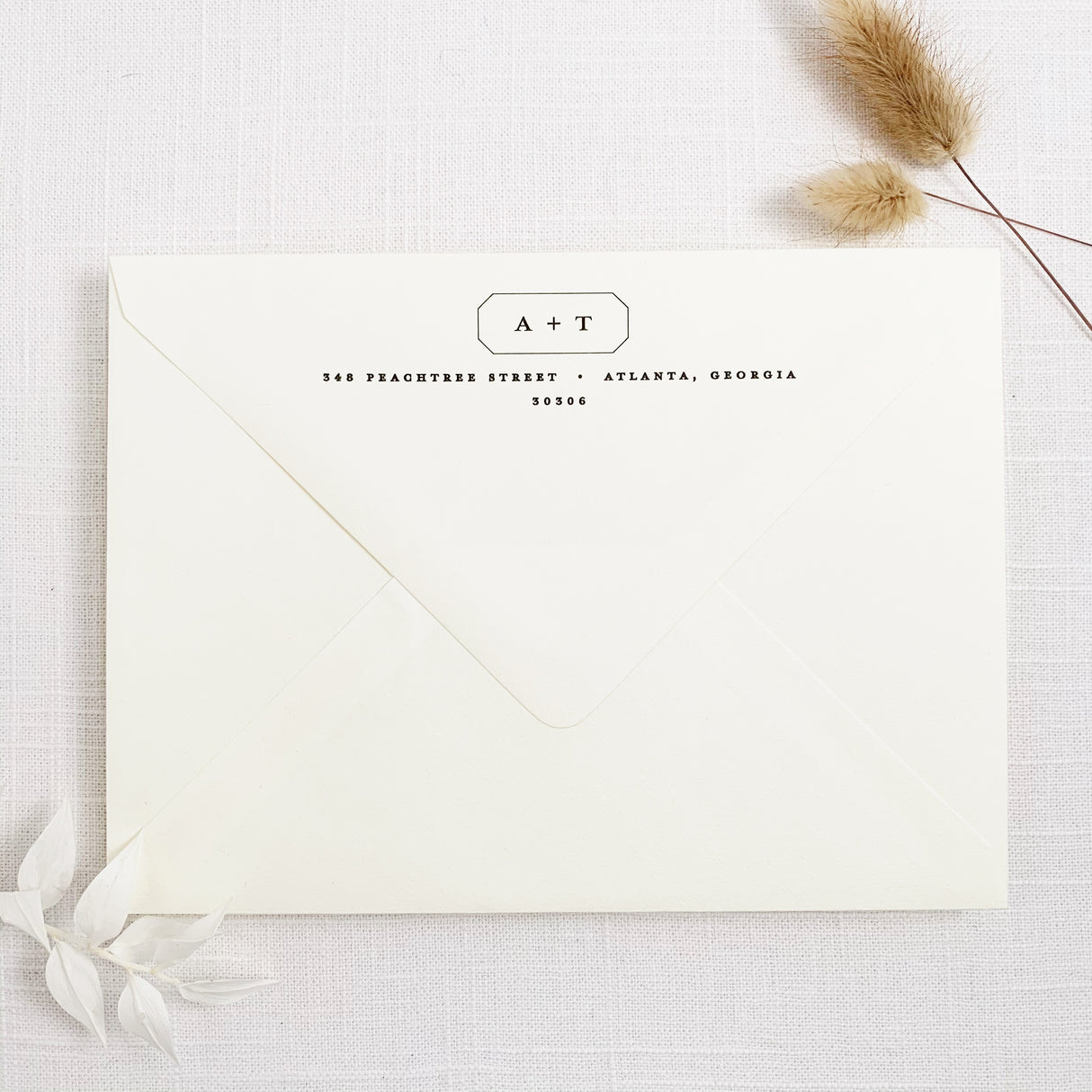 modern minimal invitation envelope with return addressing