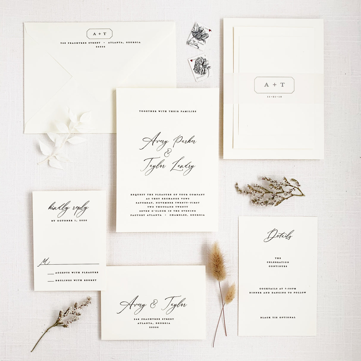 modern and minimal wedding invitation set in black and white with calligraphy script and block fonts