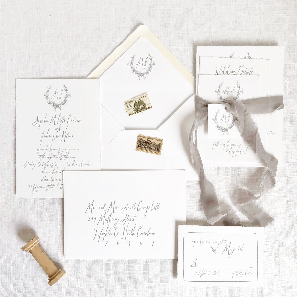 White and gray wedding invitation set with vintage crest monogram and grey silk ribbon