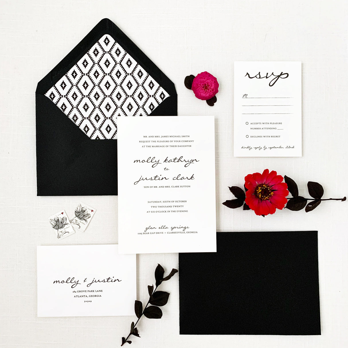 modern black and white wedding invitations, including an invitation card, envelope with printed liner, and RSVP card
