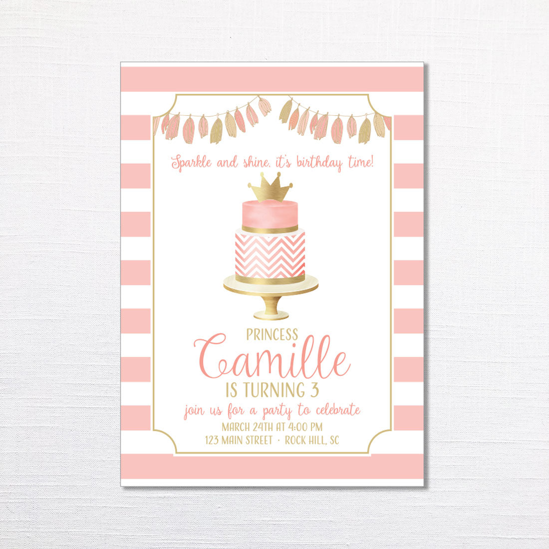 pink and gold birthday invitation featuring a pink and gold birthday cake with a tassel garland and striped background printed on white cardstock