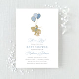 blue baby shower invitation featuring a cute bear with balloons in blue colors printed on white cardstock