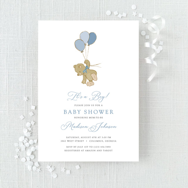 blue baby shower invitation featuring a cute bear with balloons in blue colors printed on white cardstock