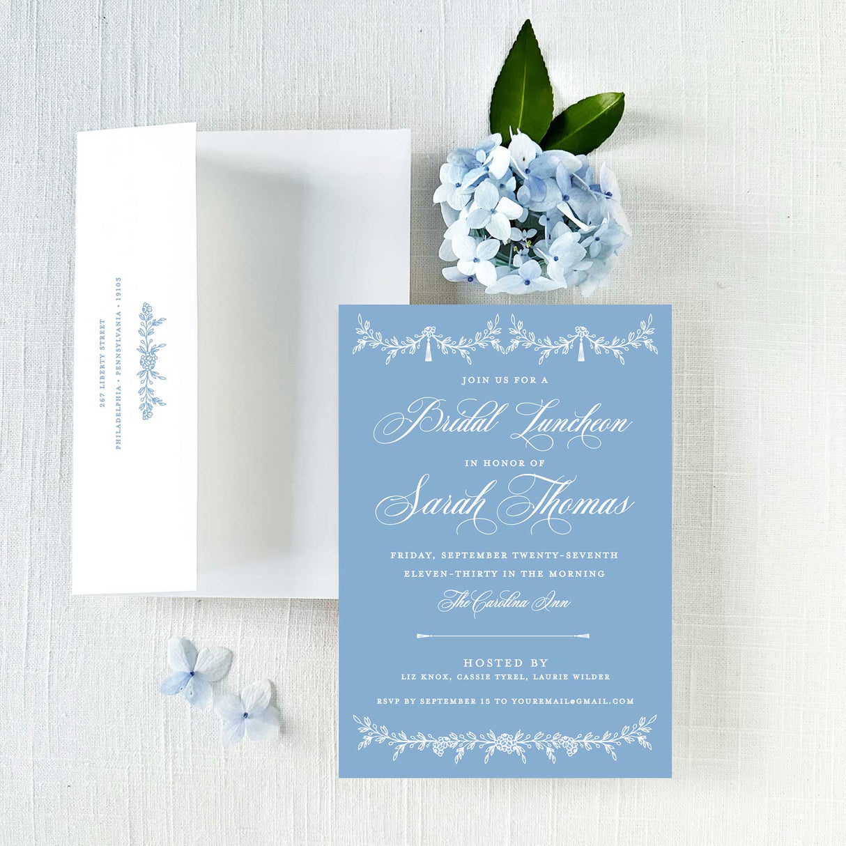 Blue bridal luncheon or bridal shower invitation with white text and envelope with return addressing