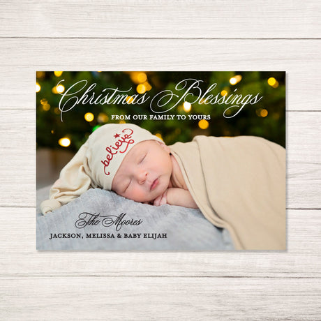 baby's first Christmas holiday photo card with Christmas Blessings in a classic script font featuring personalized photo  printed on ultra white cardstock