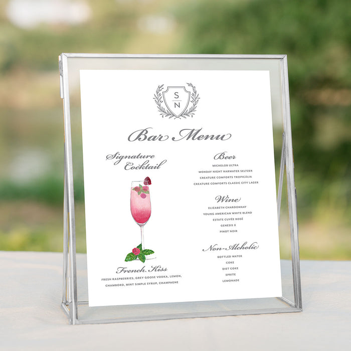 Bar menu with a watercolor illustration of signature cocktail with gray monogrammed crest printed on white cardstock