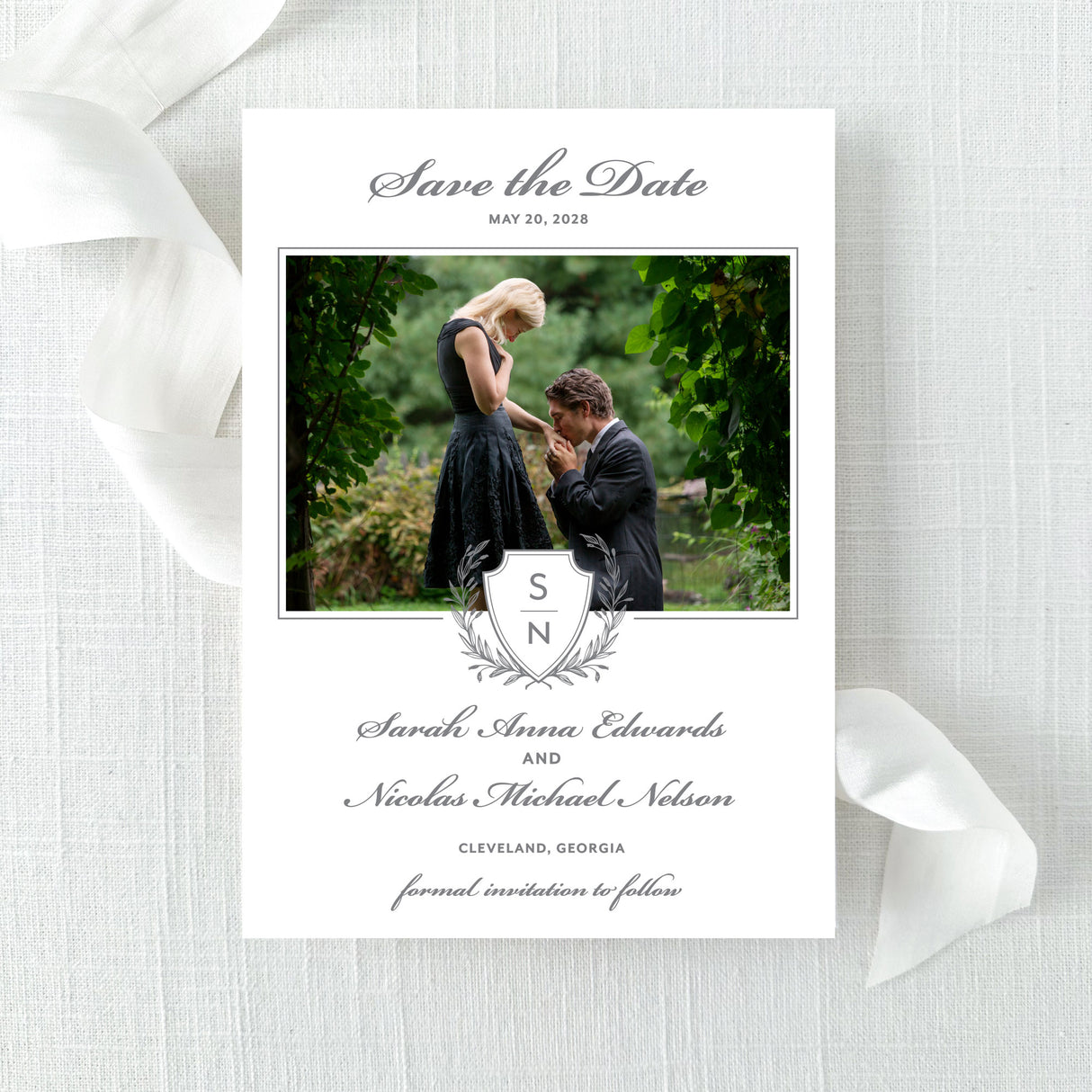 Save the Date card with personalized photo featuring a classic monogram gray crest  and traditional script font