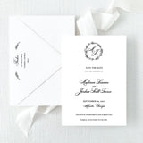 black and white wedding save the date card with wreath monogram and envelope with return addressing