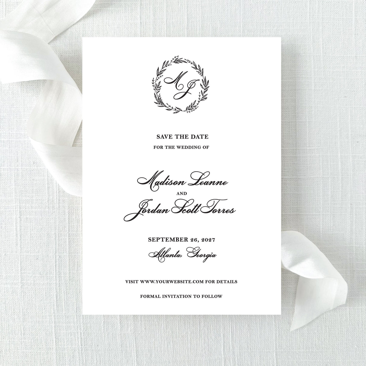 classic black and white save the date with wreath monogram