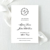 classic black and white save the date with wreath monogram