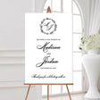 wedding welcome sign with a classic monogrammed wreath design featuring the couple's names and wedding date