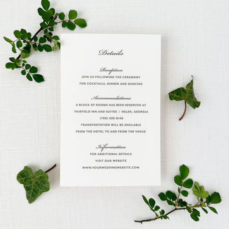 wedding details card with traditioal font in gray printed on white cardstock