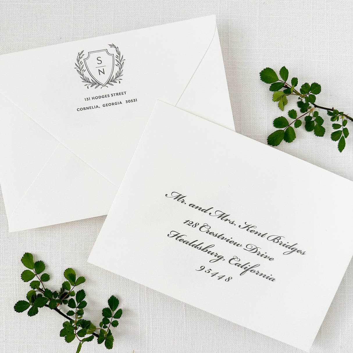 white wedding envelopes with return and guest addressing in gray classic script font