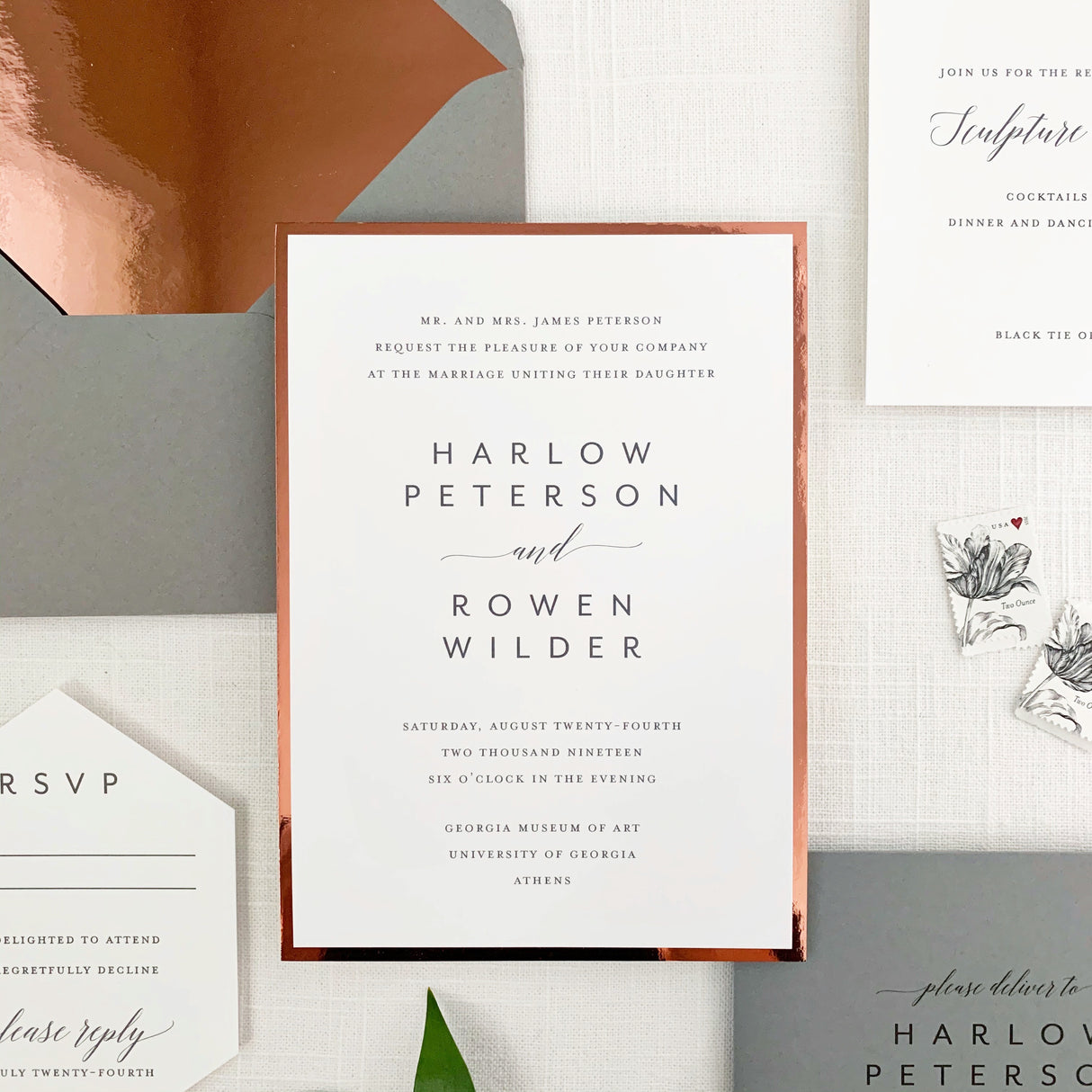 grey and white wedding invitation printed on white cardstock with mirrored copper border