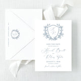 save the date with dusty blue monogram and script font and envelope with return addressing