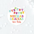 colorful fiesta round favor tag with text 'muchas gracias' printed on white cardstock