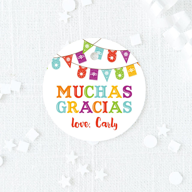colorful fiesta round favor tag with text 'muchas gracias' printed on white cardstock