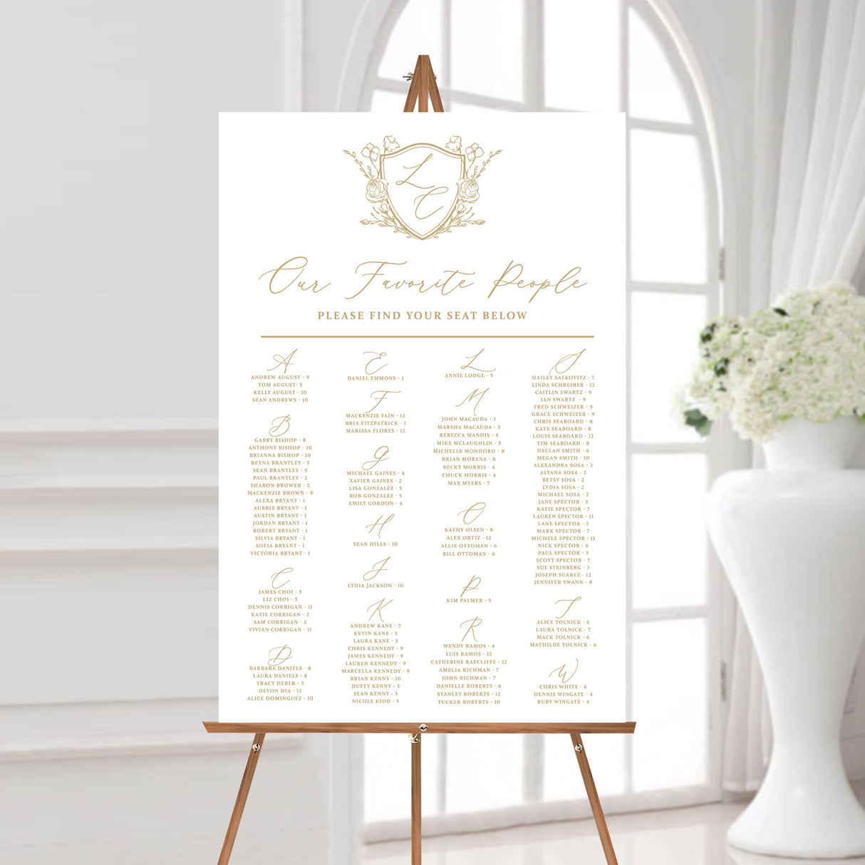 24 x 36 seating chart with gold monogrammed floral crest