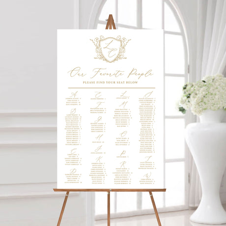 24 x 36 seating chart with gold monogrammed floral crest