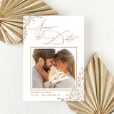save the date with coupe's photo and brown illustrated flowers and calligraphy font