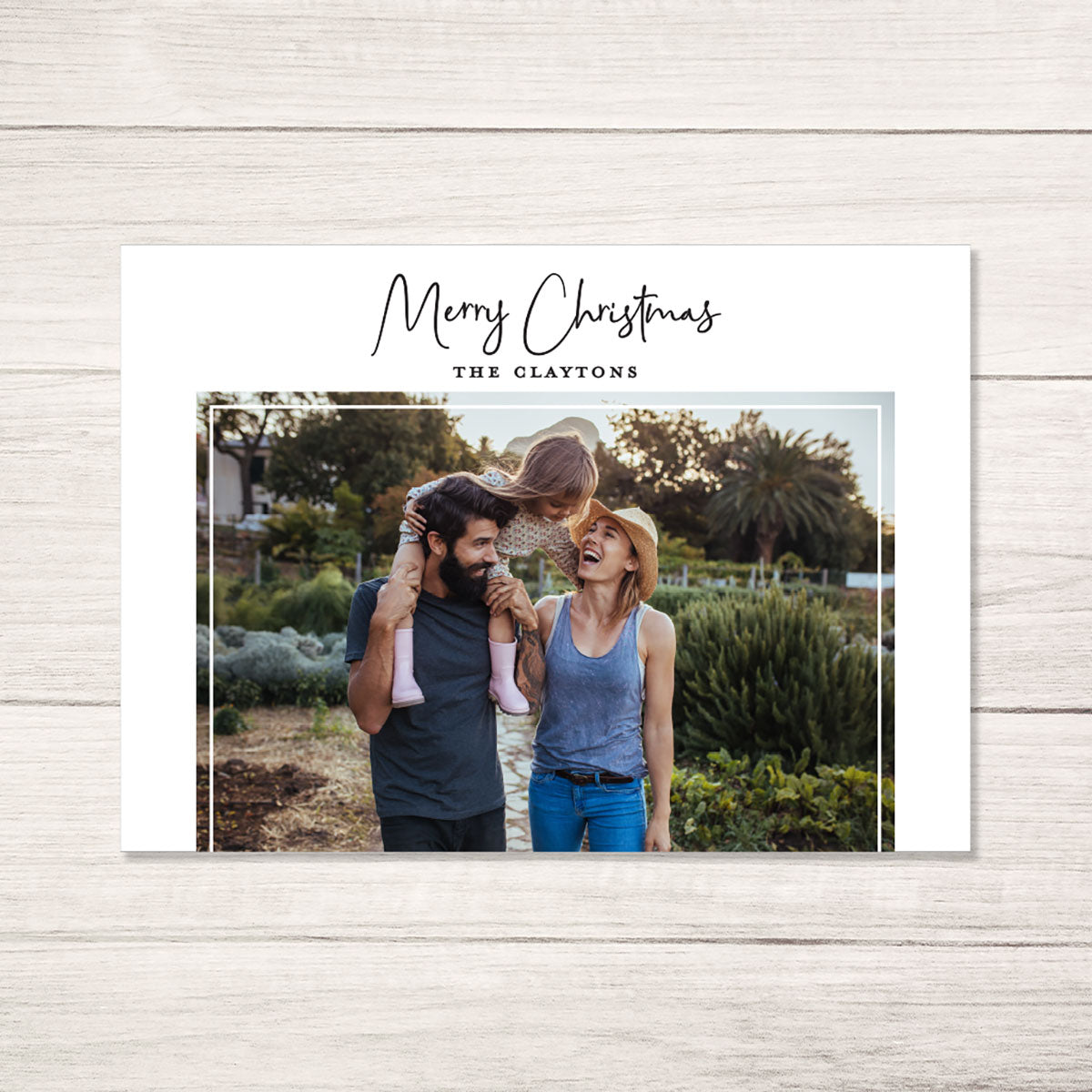 A modern Christmas card with a minimal black and white design with personalized photo 