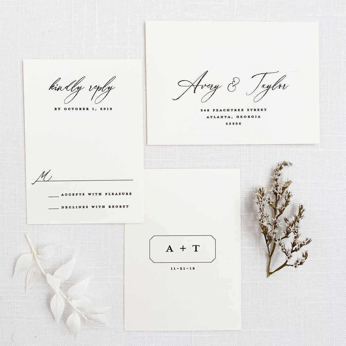 minimal rsvp card with modern monogram logo on back and envelope