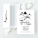 Baby shower invitation with mountain and nature-themed design on a white background with printed return address