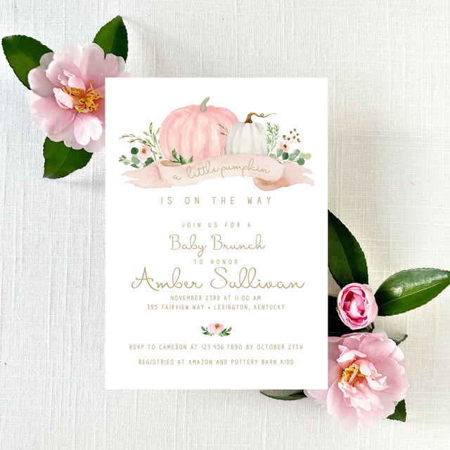 Baby shower invitation with pink and white pumpkins and flowers with gold script font