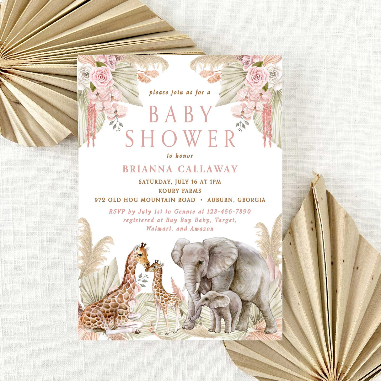 baby shower invitation with elephants and giraffes on a pink and tan floral background