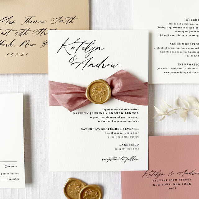 dusty rose wedding invitation with modern calligraphy fonts, dusty rose silk ribbon, and gold wax seal