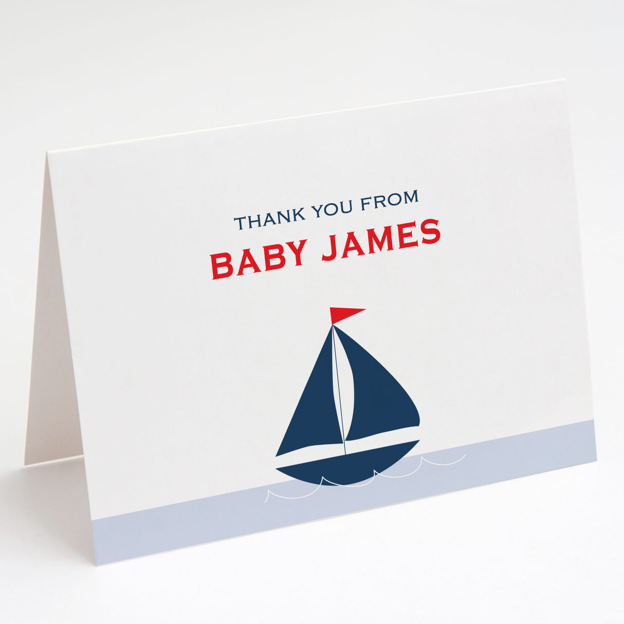 Thank you card with a red and blue sailboat design and text printed on white cardstock