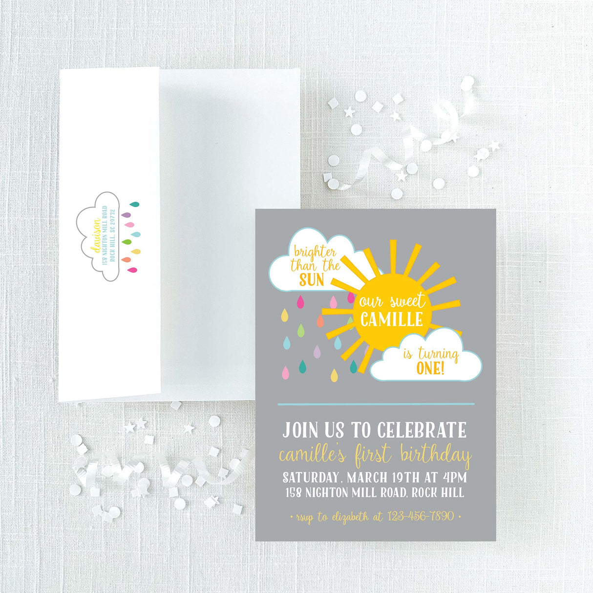 Children's birthday invitation with yellow sun and clouds with colorful rain design on a gray background printed on cardstock and white envelope with printed return address