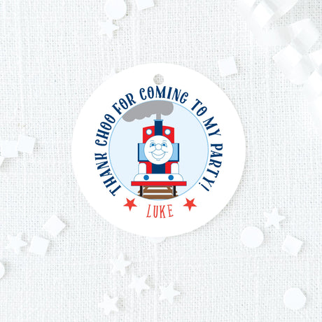 blue and red round favor tag with train design