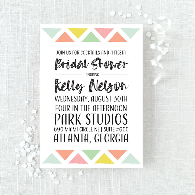 Bridal shower invitation with colorful geometric design printed on white cardstock
