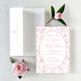 Baby shower invitation with pink floral border and envelope featuring return address