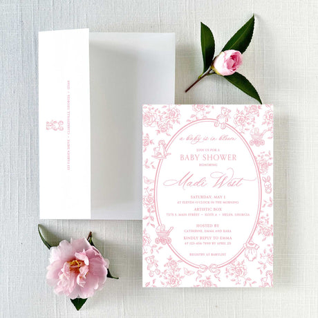 Baby shower invitation with pink floral border and envelope featuring return address