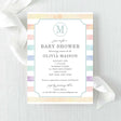 Baby shower invitation with rainbow watercolor stripes and a monogram printed on cardstock.
