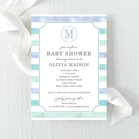 boy baby shower invitation with blue green watercolor stripes and a monogram printed on cardstock.