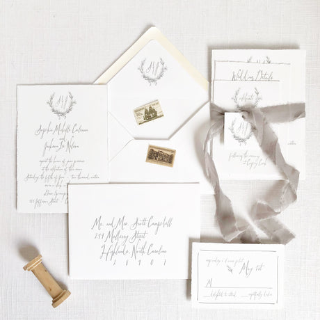 White and gray wedding invitation set with vintage crest monogram and grey silk ribbon