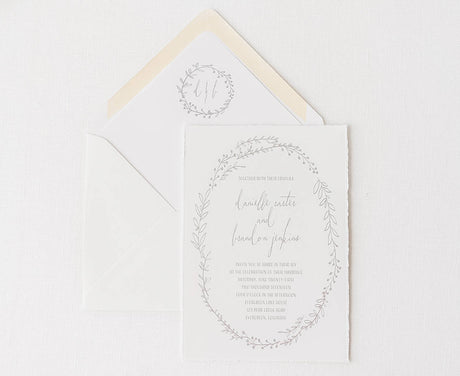 wedding invitation and envelope printed in grey on handtorn cotton cardstock with monogrammed envelope liner