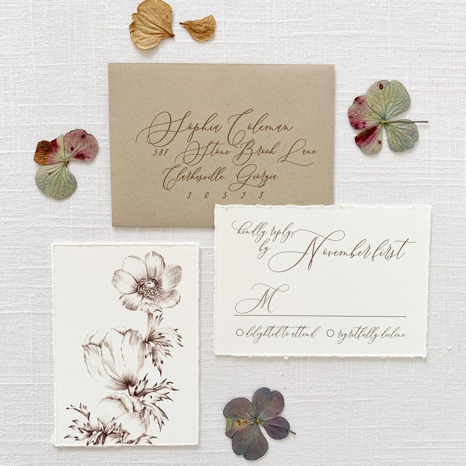wedding rsvp cards printed on off white cardstock with vintage flower illustrations and natural khaki envelope